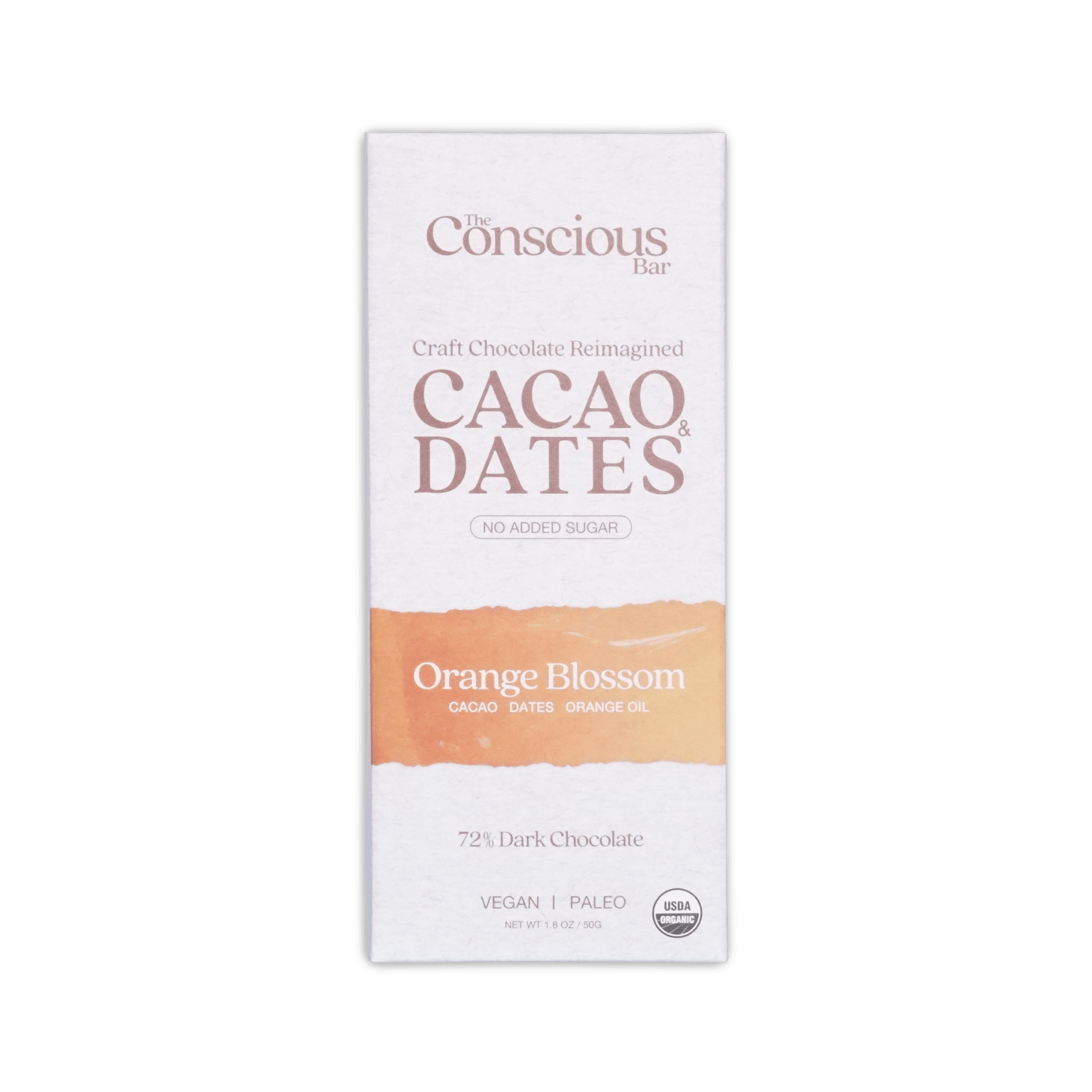 The conscious bar dark orange blossom 72 percent cacao and dates chocolate bar in white and peach minimalist wrapper