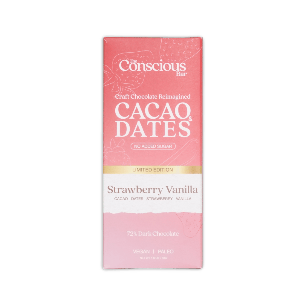 A pink rectangular package of the conscious bar strawberry vanilla special edition 72 percent chocolate bar with white and gold text