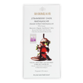 White rectangular wrapper for the organic house strawberry dark madagascar chocolate bar with strawberries and green leaves