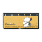 Zotter Cheesecake Milk Chocolate 50% bar with cartoon on golden wrapper