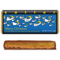 Zotter Merry Christmas wrapper with flying angels above a cut bar showing marzipan and praline.