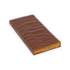 An unwrapped Zotter milk chocolate bar with a rippled top and a green marzipan layer at the cut end.