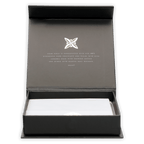 Elegant matte black Fruition Brown Butter Bourbon Caramels gift box with white chocolate bars