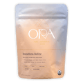 Sleek matte Ora Boundless Belize ceremonial cacao pouch in peach gradient with gold foil