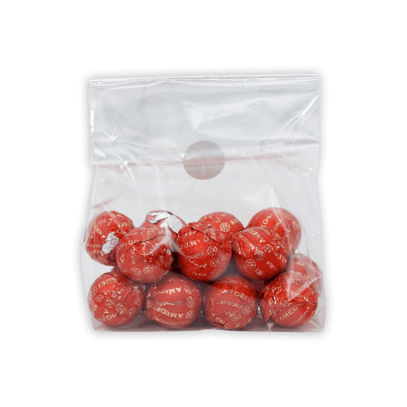 Amedei Pralines Dark w/ Almond Filling in clear bag of red foil-wrapped candies