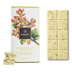 Amedei White Milk Chocolate w/ Pistachios 29% bar with creamy pale yellow surface and greenish nuts