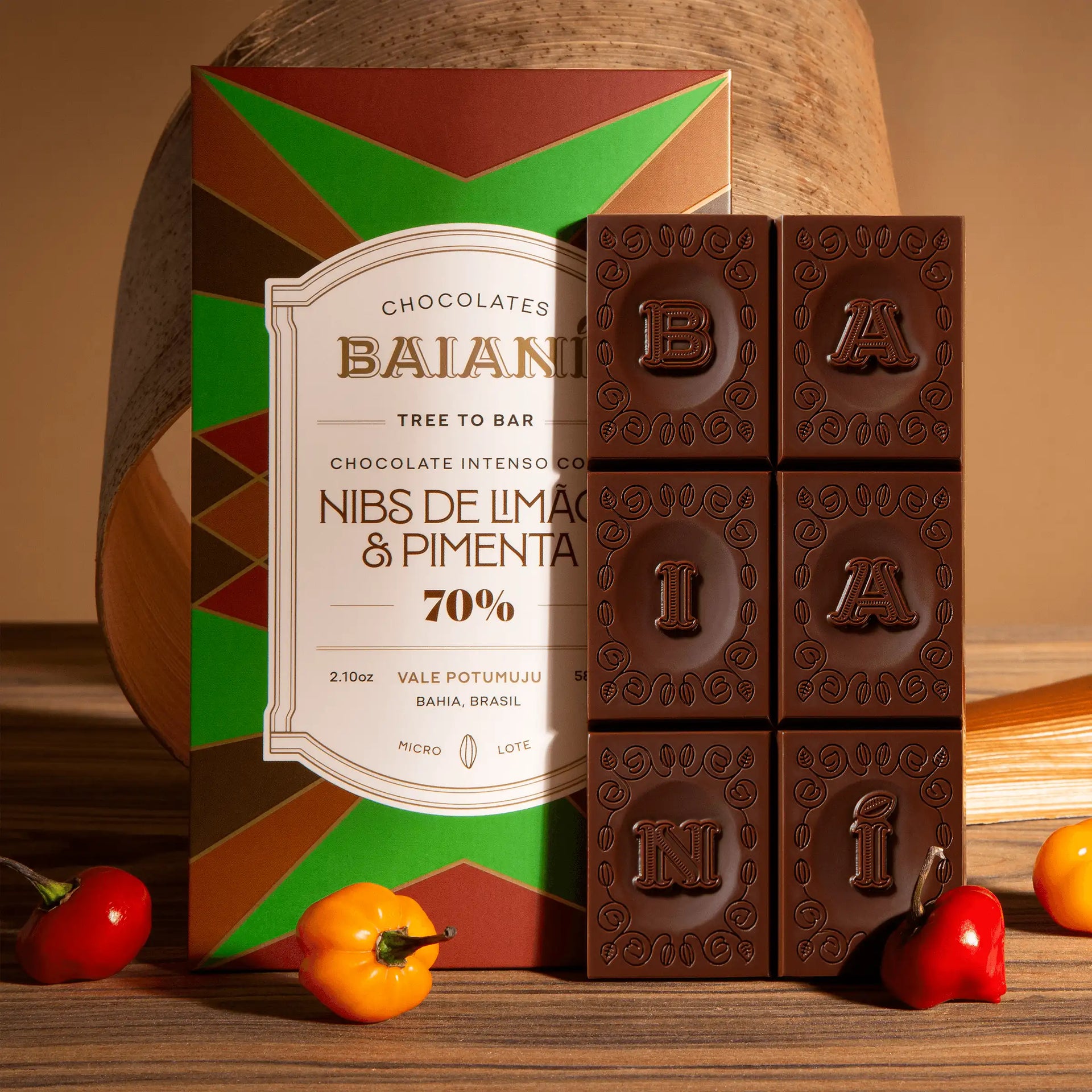 A rich dark chocolate bar embossed with baiani letters featuring lime and chili nibs 70 percent cacao