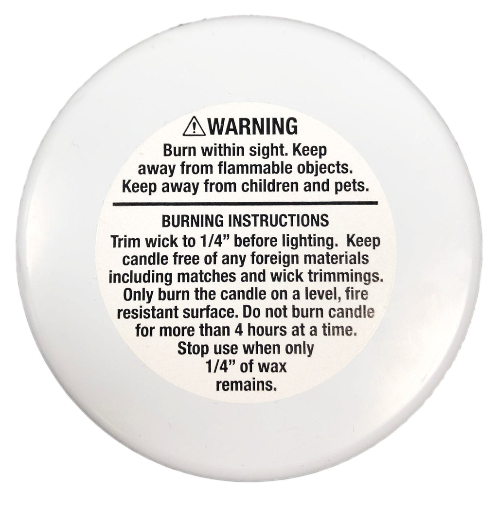 Back of Bar & Cocoa Chocolate Candle: white circular candle with printed warning and burning instructions label