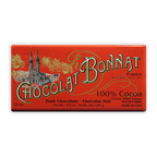 Bonnat 100% Noir Cacao bar with vibrant red wrapper and cathedral illustration