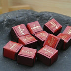 Domori Classic Gianduja Cremino Bag in red square boxes with gold foil branding