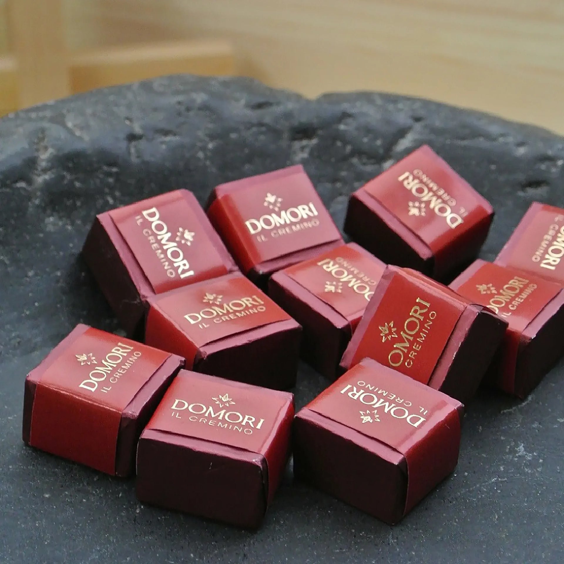 Domori Classic Gianduja Cremino Bag in red square boxes with gold foil branding