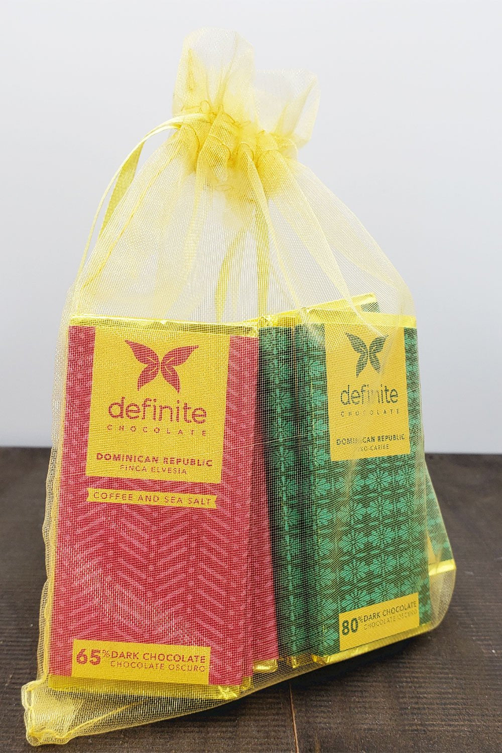 Definite Chocolate 65% red and 80% green mini bars in yellow bag
