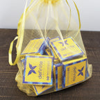 Yellow sheer organza bag with Definite Chocolate 50% milk Napolitans