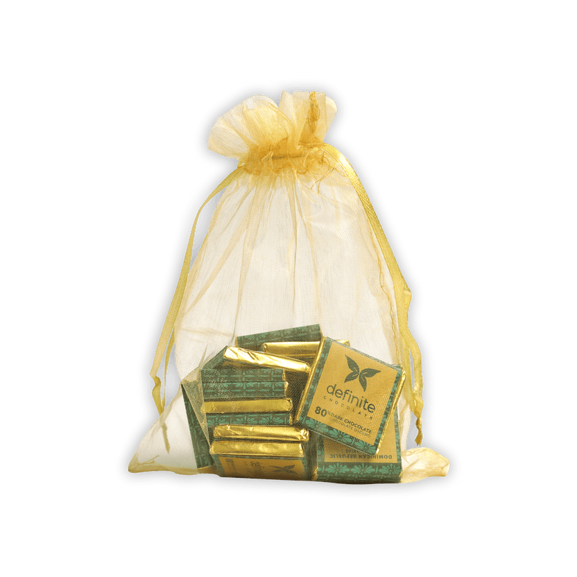 Sheer white organza bag with gold drawstring holding Definite Chocolate Napolitans minis