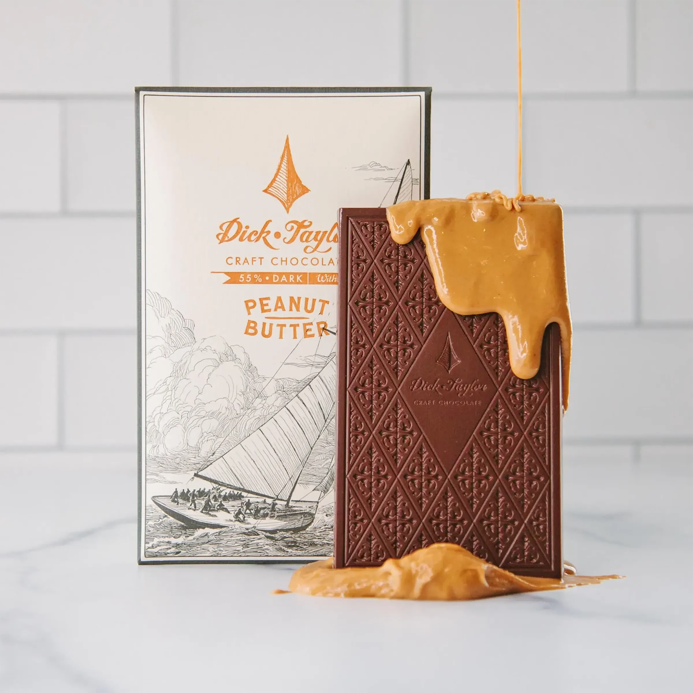 Dick Taylor Chocolate Peanut Butter 55% bar with diamond pattern and PB drizzle