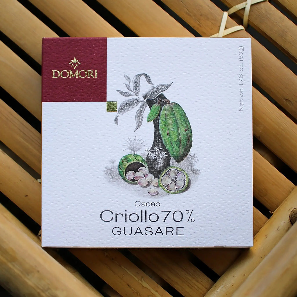 Domori Guasare Criollo 70% cacao bar in white maroon box with cocoa pods