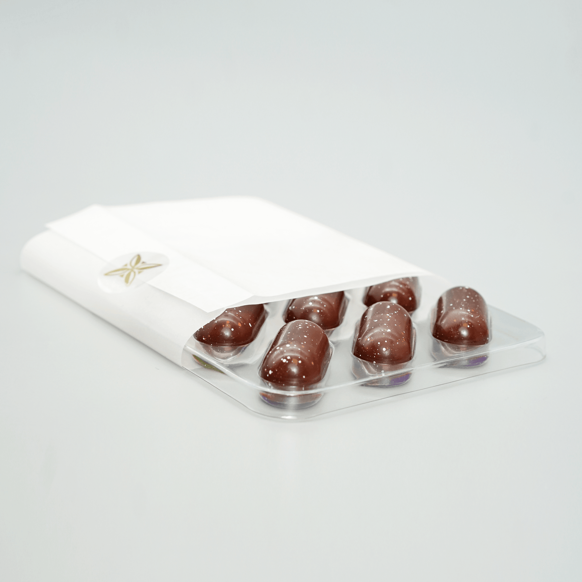 Fruition Brown Butter Bourbon Caramels 68% in white wrapper with gold star and 6 chocolates