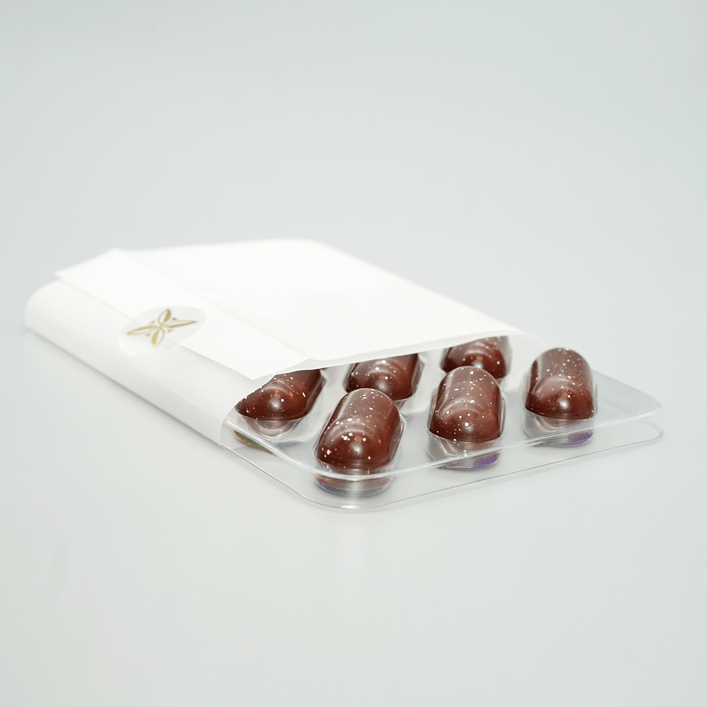 Fruition Brown Butter Bourbon Caramels 68% in white wrapper with gold star and 6 chocolates