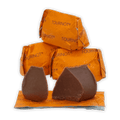 Two Guido Gobino Tourinot Classico dark chocolate pieces on orange foil