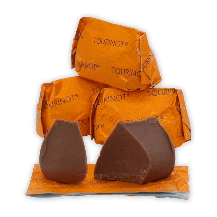 Two Guido Gobino Tourinot Classico dark chocolate pieces on orange foil