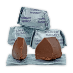 Two Guido Gobino Tourinot Maximo chocolates on foil packaging