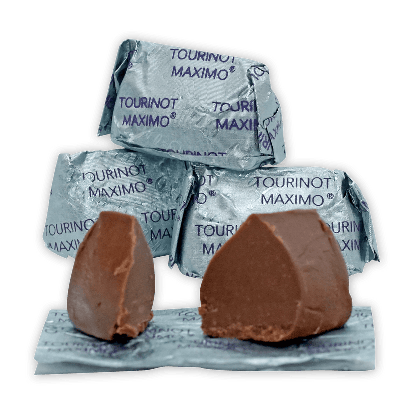 Two Guido Gobino Tourinot Maximo chocolates on foil packaging