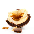 Halved Soma dark chocolate covered hazelnut with glossy shell and creamy filling
