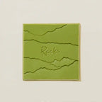 Raaka Matcha Waffle Cone 40% olive-green ceramic tile with wavy lines and Raaka script