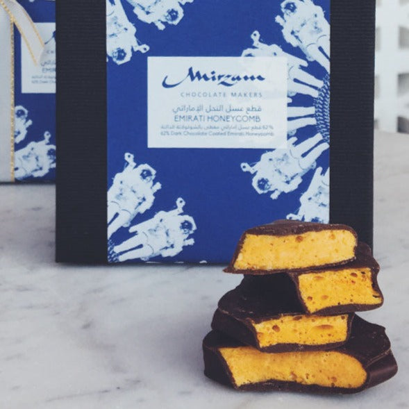 Stack of Mirzam 62% dark chocolate honeycomb with golden porous interior