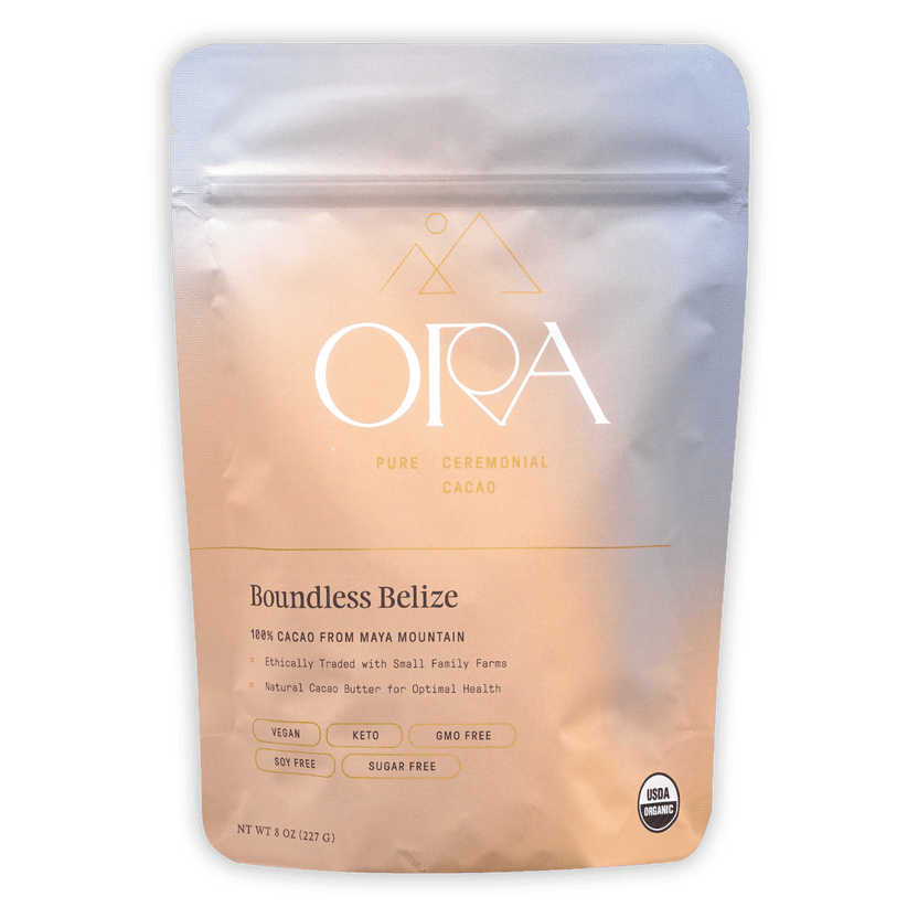 Sleek matte Ora Boundless Belize ceremonial cacao pouch in peach gradient with gold foil