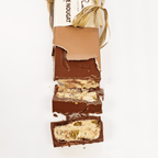 Pralus Infernale Nougat Bar partially unwrapped with pistachios