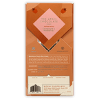 Back of Ritual Après Chocolate 70% (Raspberry & Sparkling Wine) bar package with champagne & raspberry tasting notes in orange pink geometric design