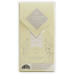 Ritual One Hundred Percent pale yellow chocolate bar wrapper with silver foil and botanical illustrations