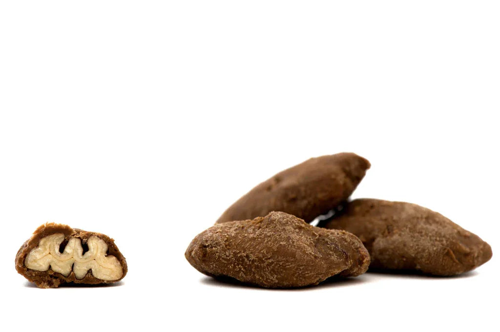Soma Chocolate Pecan Pie Pralines: chocolate-covered walnuts, one halved