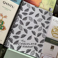 The Chocolate Notebook with cocoa pod line art on white cover